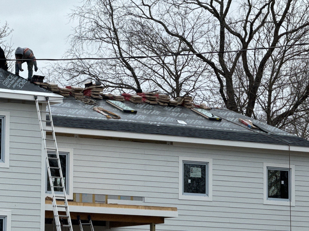 VELUX fixed skylight installed on sloped roof plane with surrounding Landmark Premium shingles