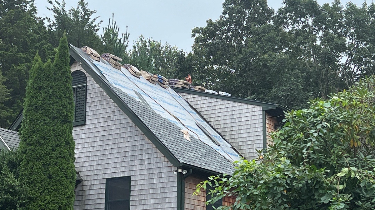 Roof replacement in progress with underlayment visible in Jamestown RI by Pinnacle Roofing