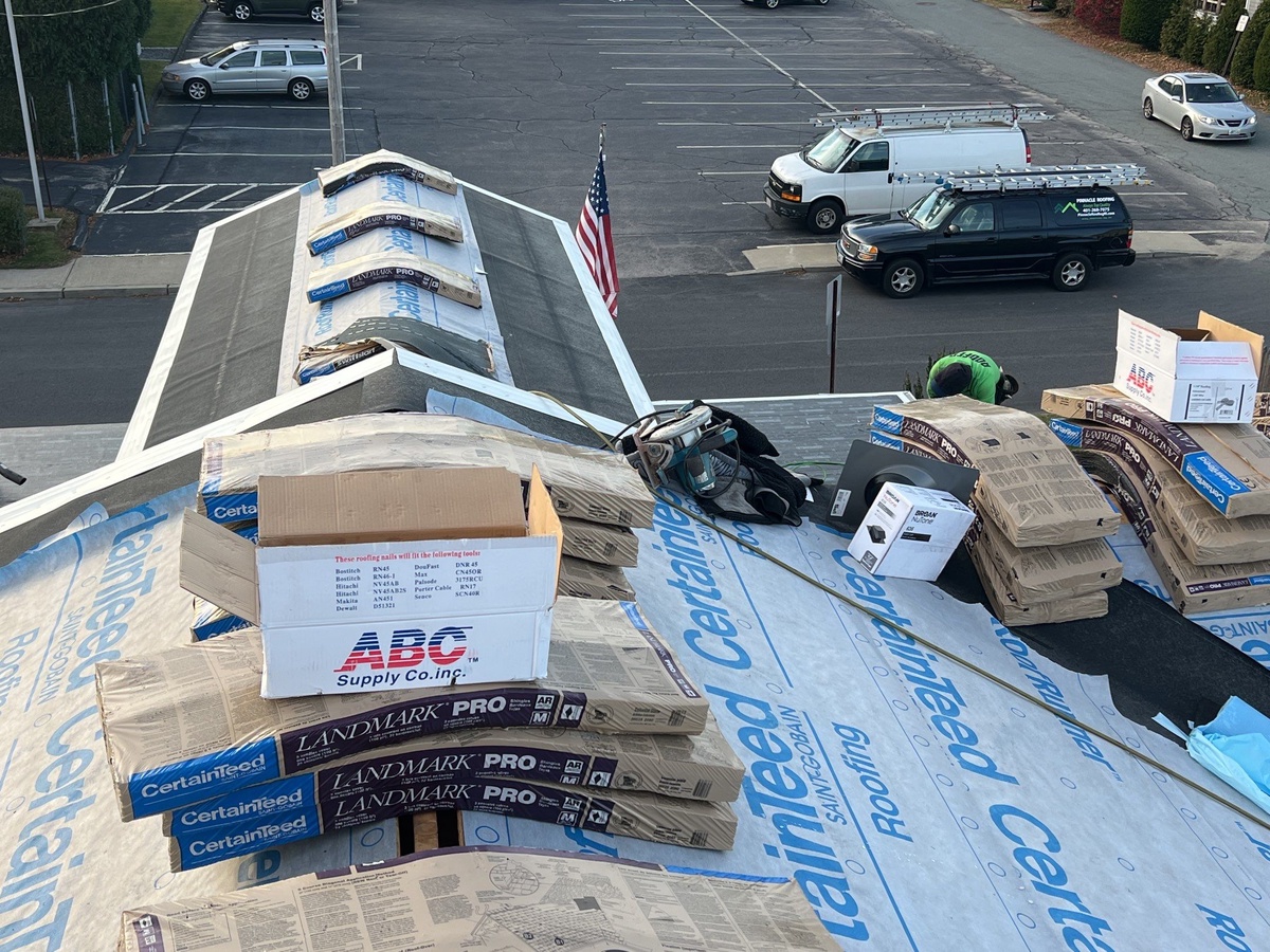 Modified bitumen flat roof section on Jamestown home with Landmark PRO steep slope