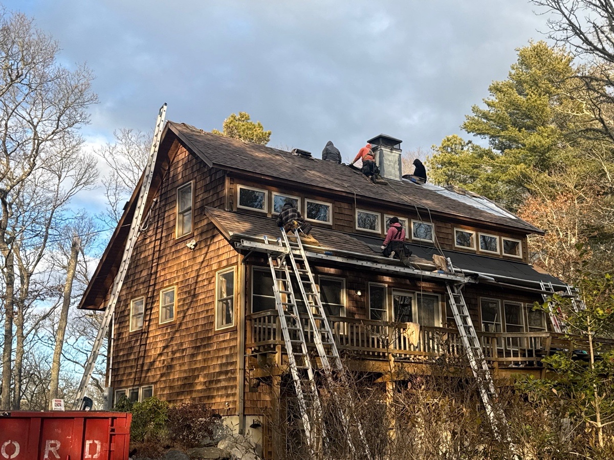 Rear elevation of South Kingstown home with new CertainTeed Landmark PRO roof and VELUX skylights