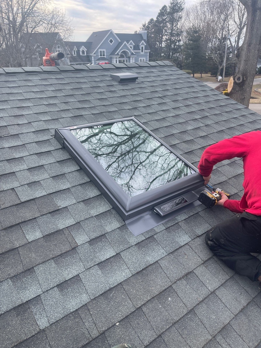 Wide view of Moire Black roof with multiple VELUX skylights on Briarcliff Avenue Warwick RI