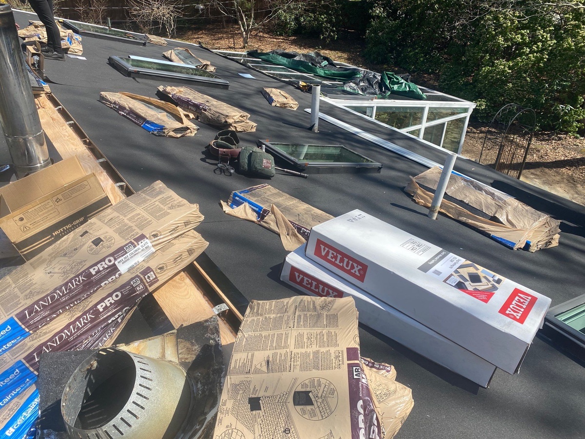 CertainTeed Landmark PRO and VELUX skylight materials during installation in Kingston RI