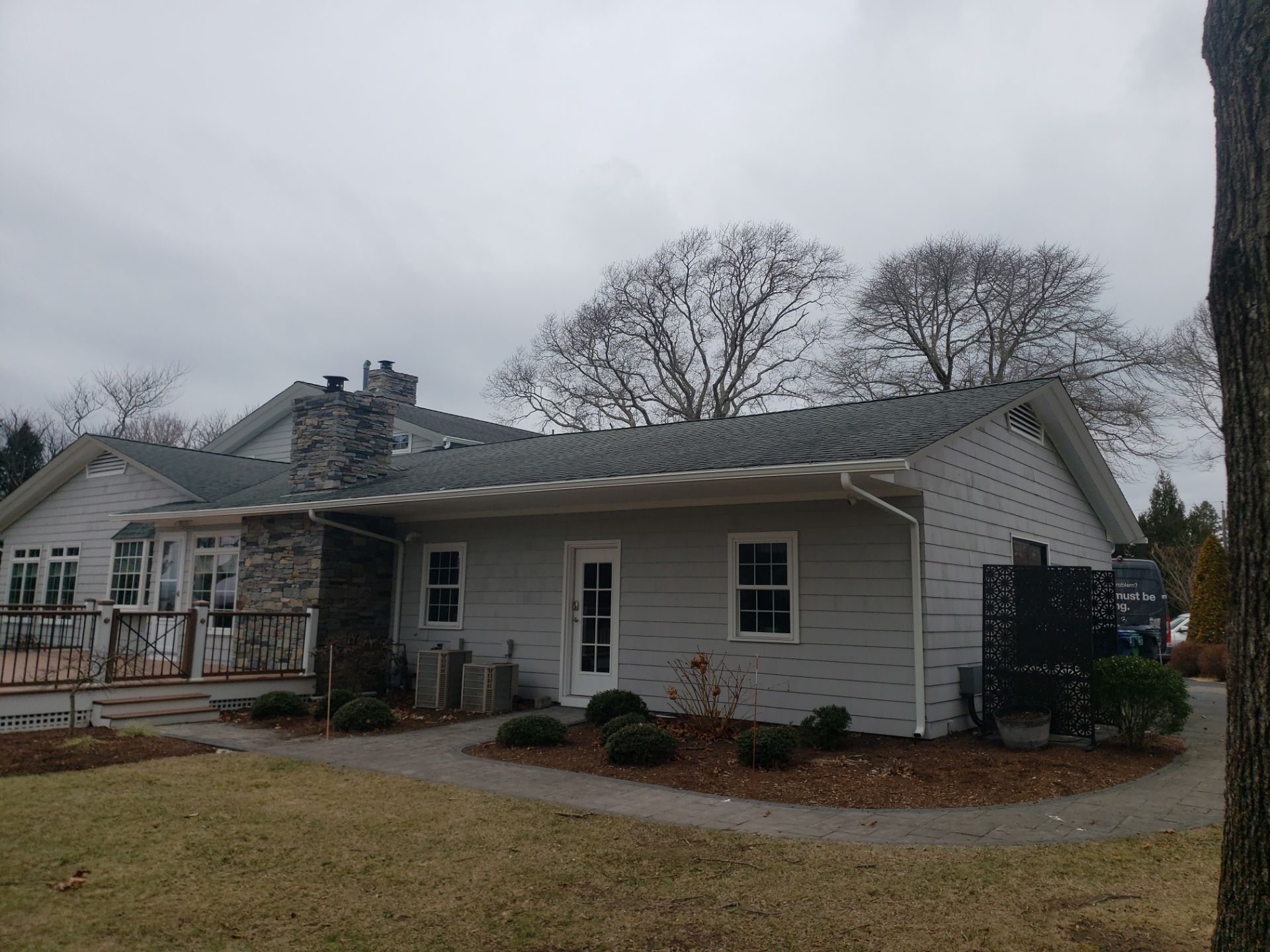 CertainTeed Landmark PRO Moire Black Roof and VELUX Skylight Replacement with Solar Coordination in Warwick, RI