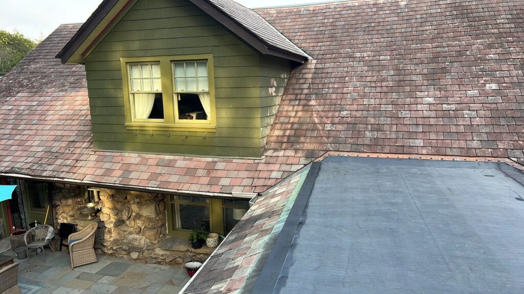 EPDM flat roof membrane restoration completed on historic hunting lodge in Johnston RI by Pinnacle Roofing