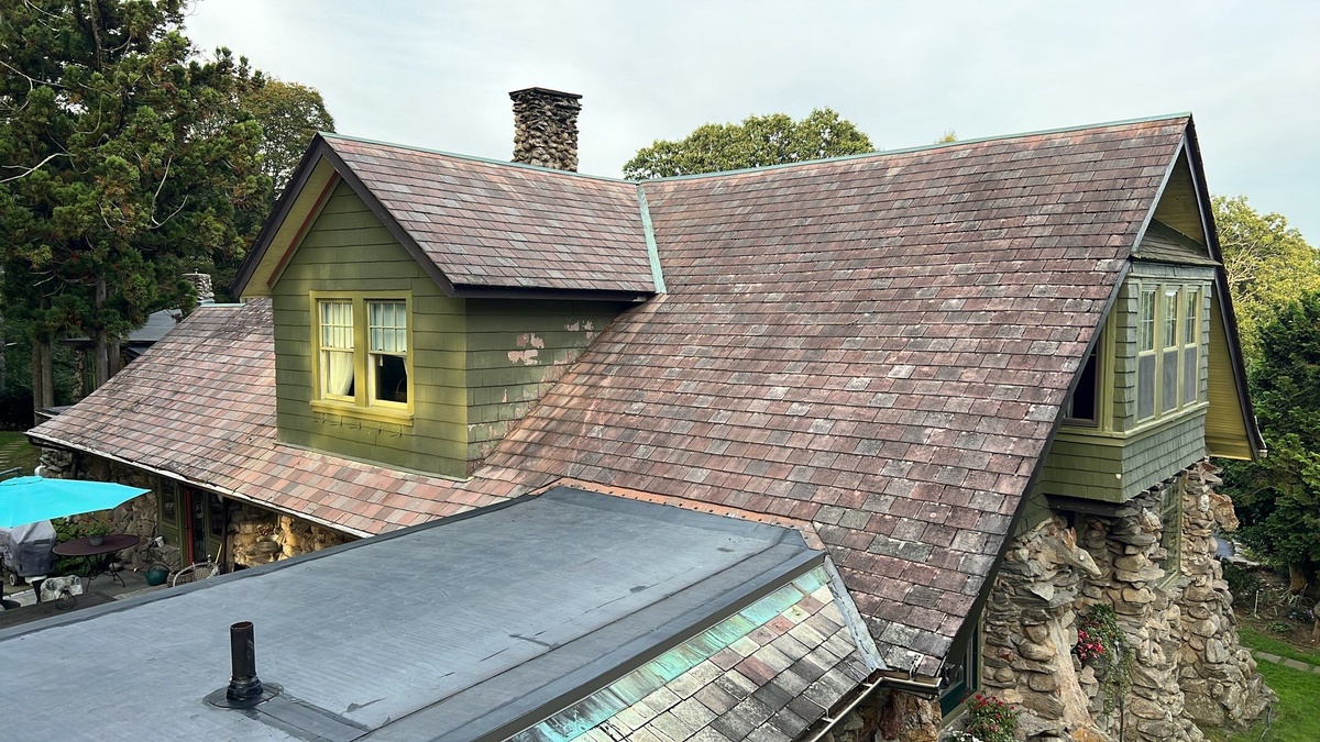 Wide drone view of EPDM flat roof restoration on historic lodge in Johnston RI
