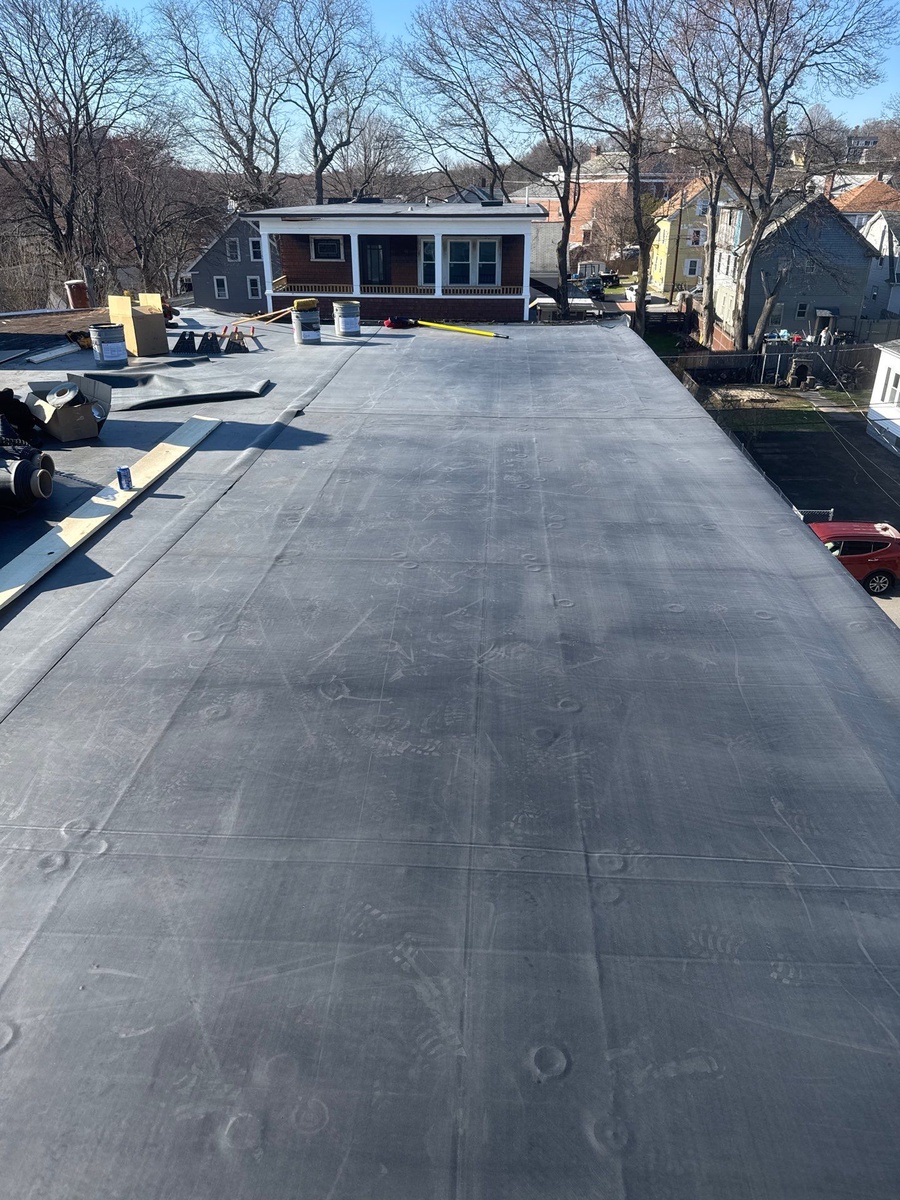 EPDM membrane flashing detail at parapet wall on North Providence flat roof