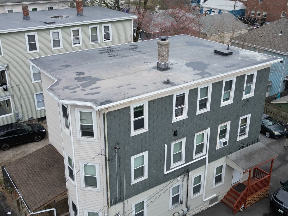 EPDM membrane penetration flashing detail on North Providence flat roof