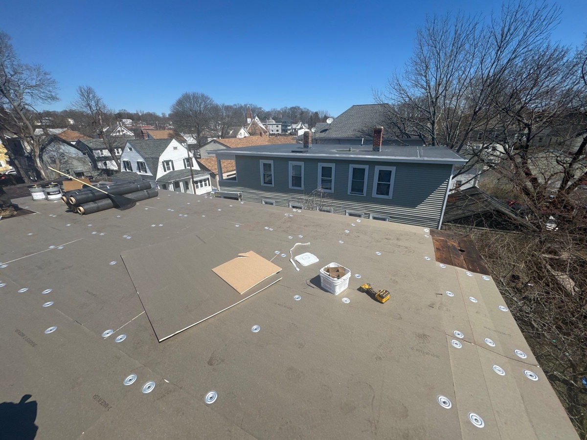 Final view of completed EPDM rubber roof and chimney repointing in North Providence RI