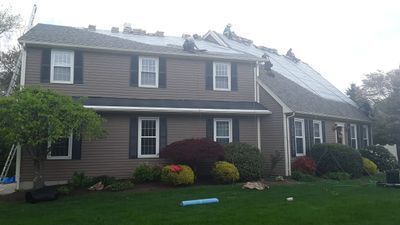 Restored Lincoln colonial after storm roof replacement