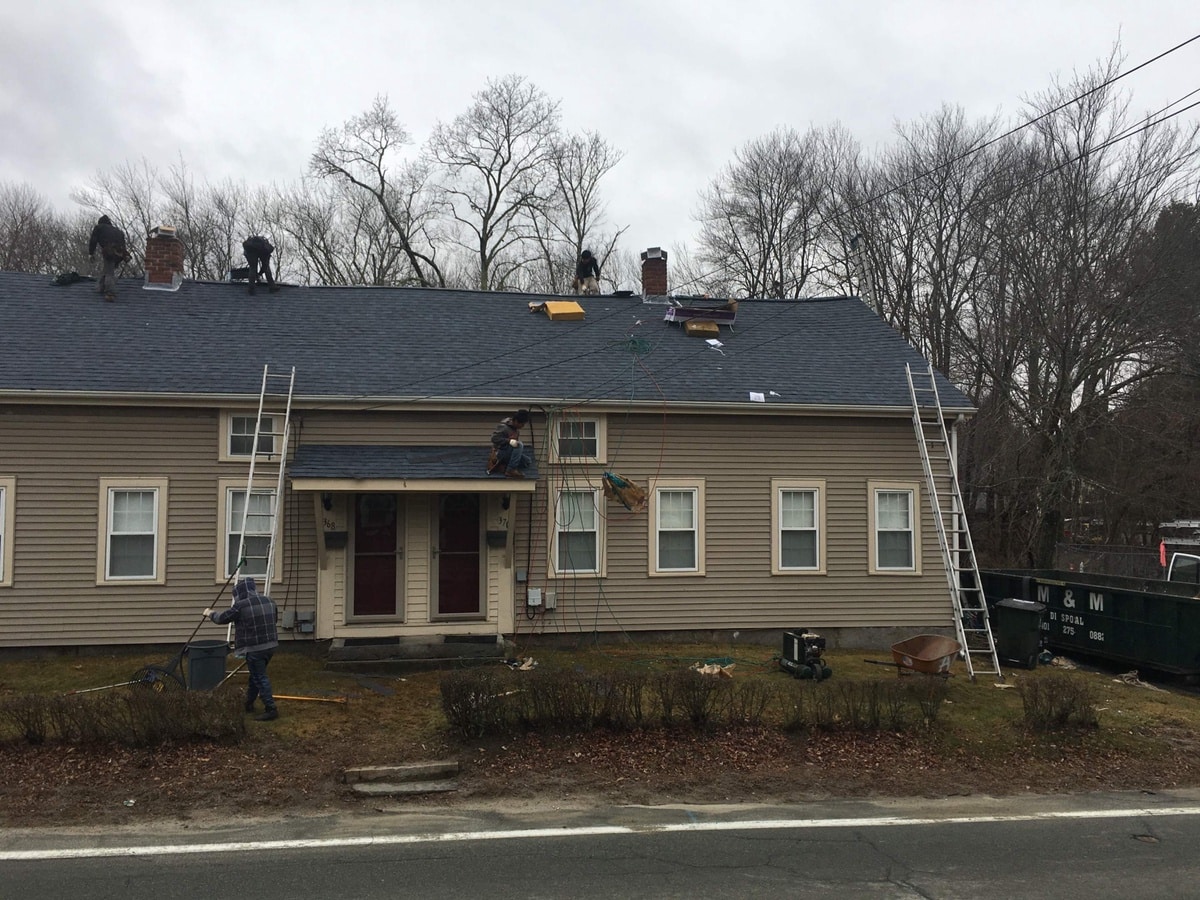 Crew tearing off and re-decking Burrillville Church Street roof