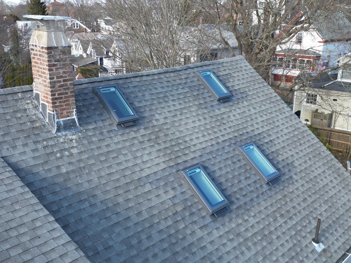 After — Newport, RI Roof Repair: Chimney Rebuild, VELUX Skylights & Solar-Powered Venting