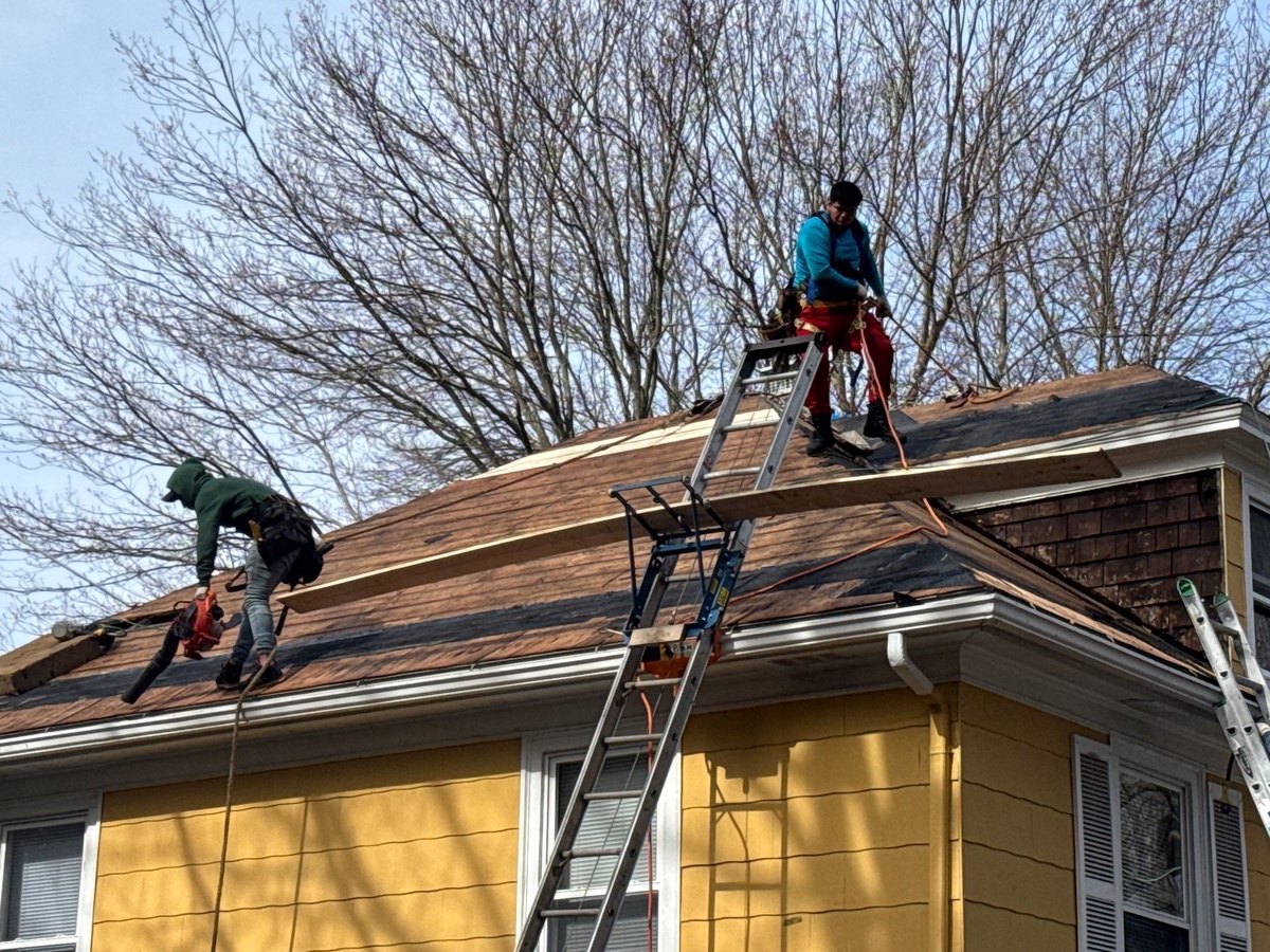 Crew removing old roof West Warwick RI roof replacement