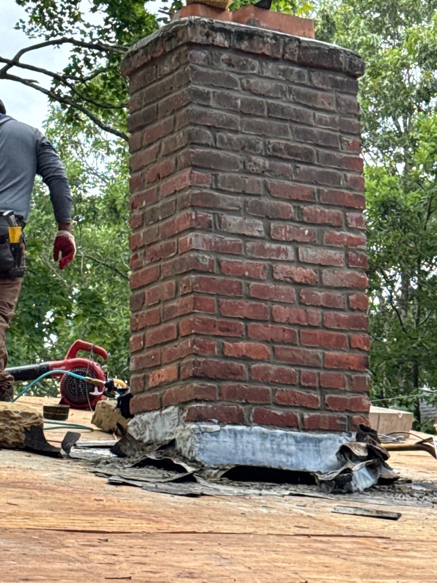 New flashing at chimney base on Landmark PRO Weathered Wood roof North Kingstown
