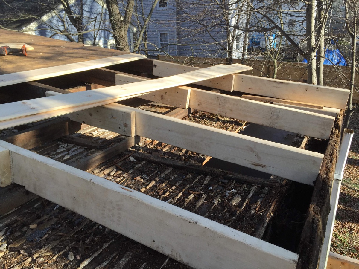 Old low-slope roof structure exposed during Newport RI tear-off