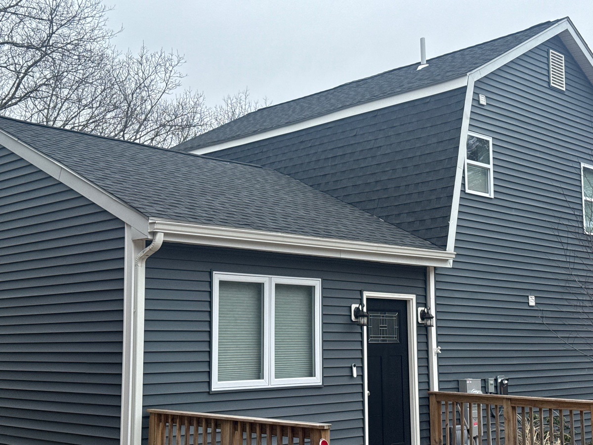 New roofing replacing vinyl siding on Johnston RI mansard slope