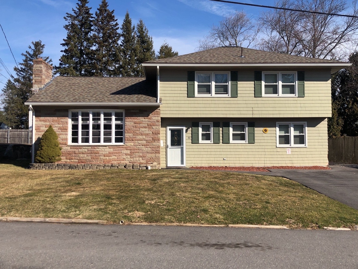 After — Johnston, RI Gutter Systems: Seamless Gutters, ShurFlo Leaf Guards & PVC Trim with a Landmark PRO Weathered Wood Roof on Contillo Drive