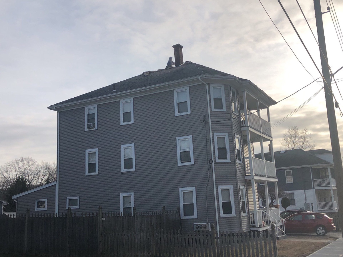 After — A 100-Year-Old Lincoln, RI Roof Rebuilt — New Plywood Deck, Chimney Repointing, and Landmark in Pewterwood