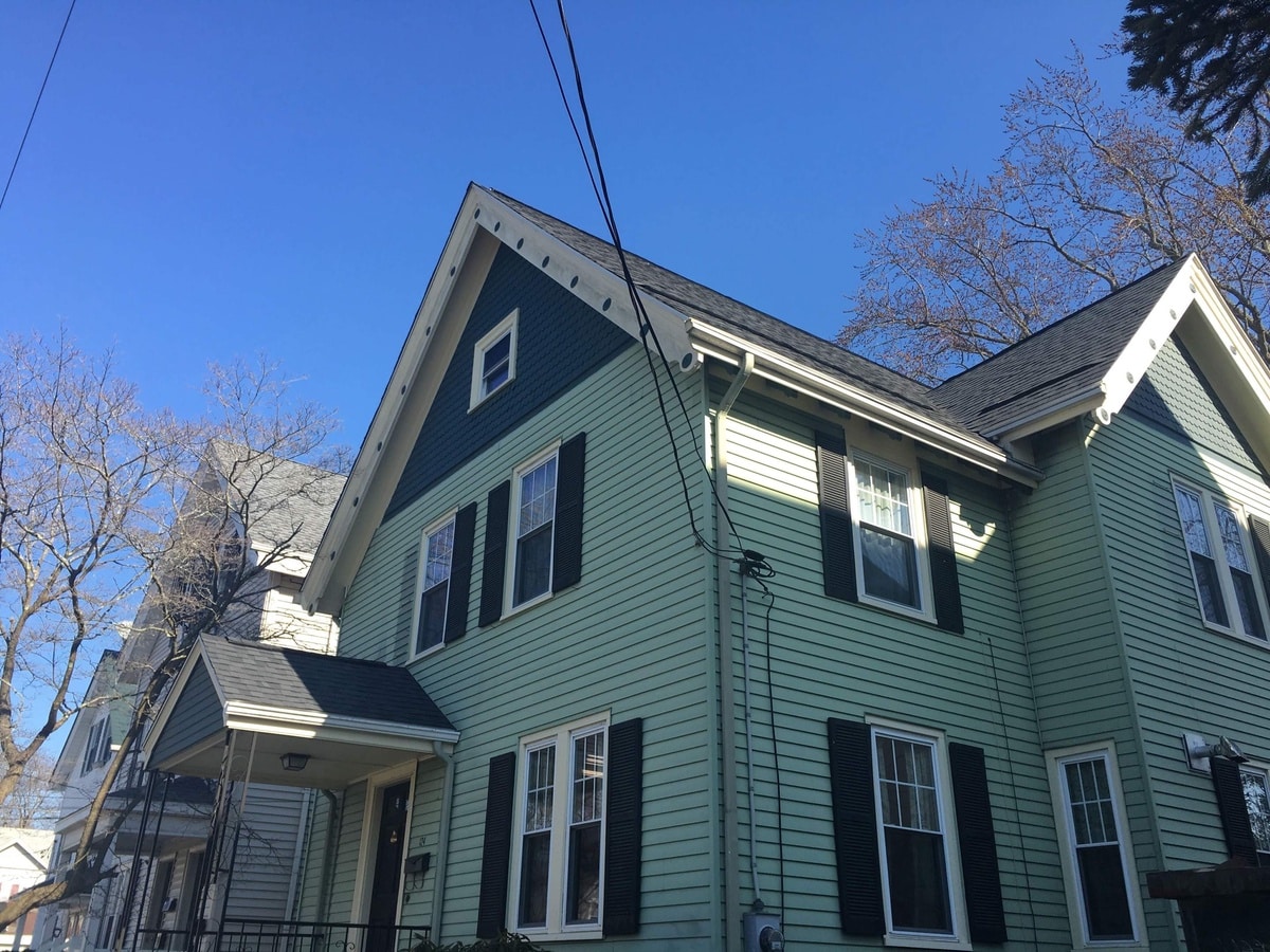 Lincoln, RI Roof Replacement: CertainTeed Landmark Moire Black with Lomanco Intake Ventilation