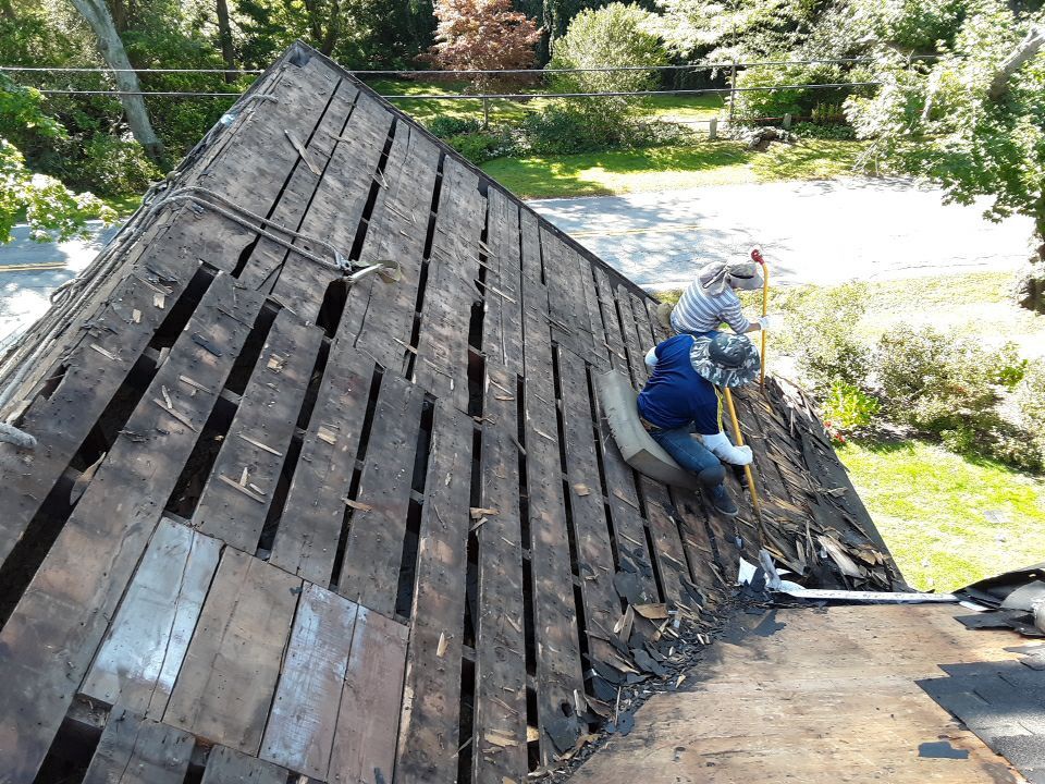 Century old plank roof deck exposed Jamestown RI storm damage replacement