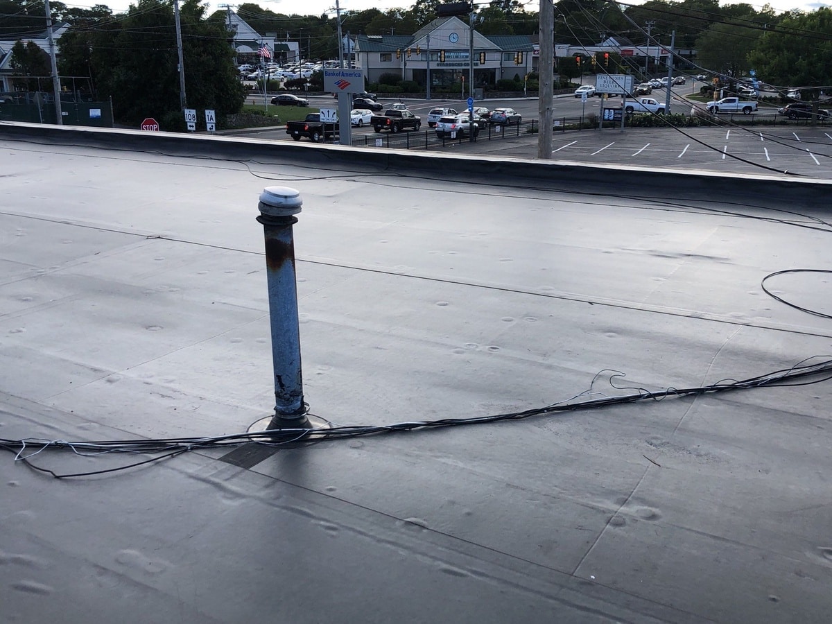 New EPDM membrane sealed around rooftop vent, South Kingstown