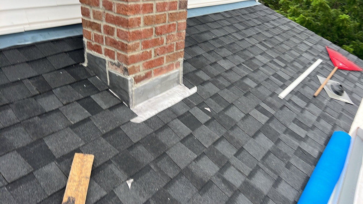 Chimney flashing on NorthGate ClimateFlex Moire Black roof Richmond RI