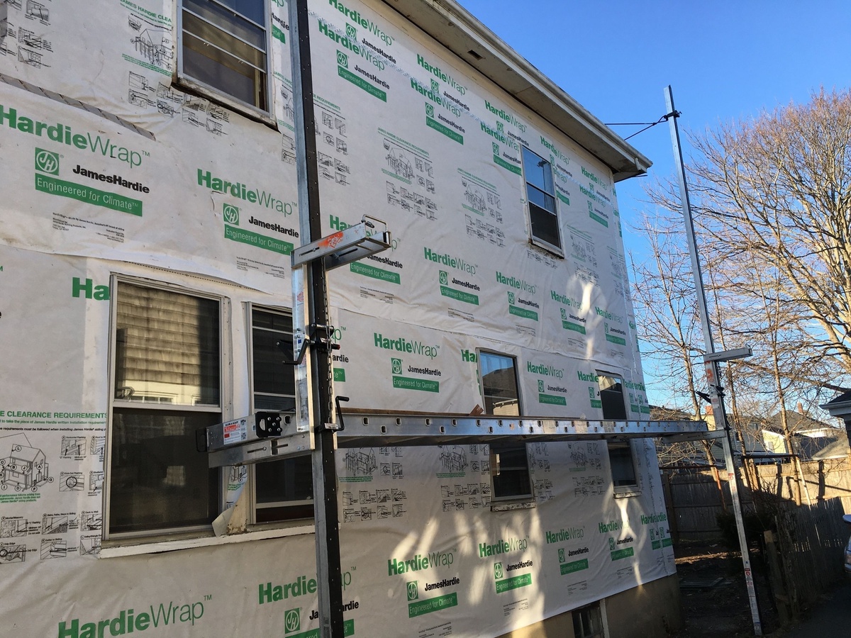 Full view of James Hardie Plank siding and CertainTeed Landmark PRO roof renovation in Newport RI
