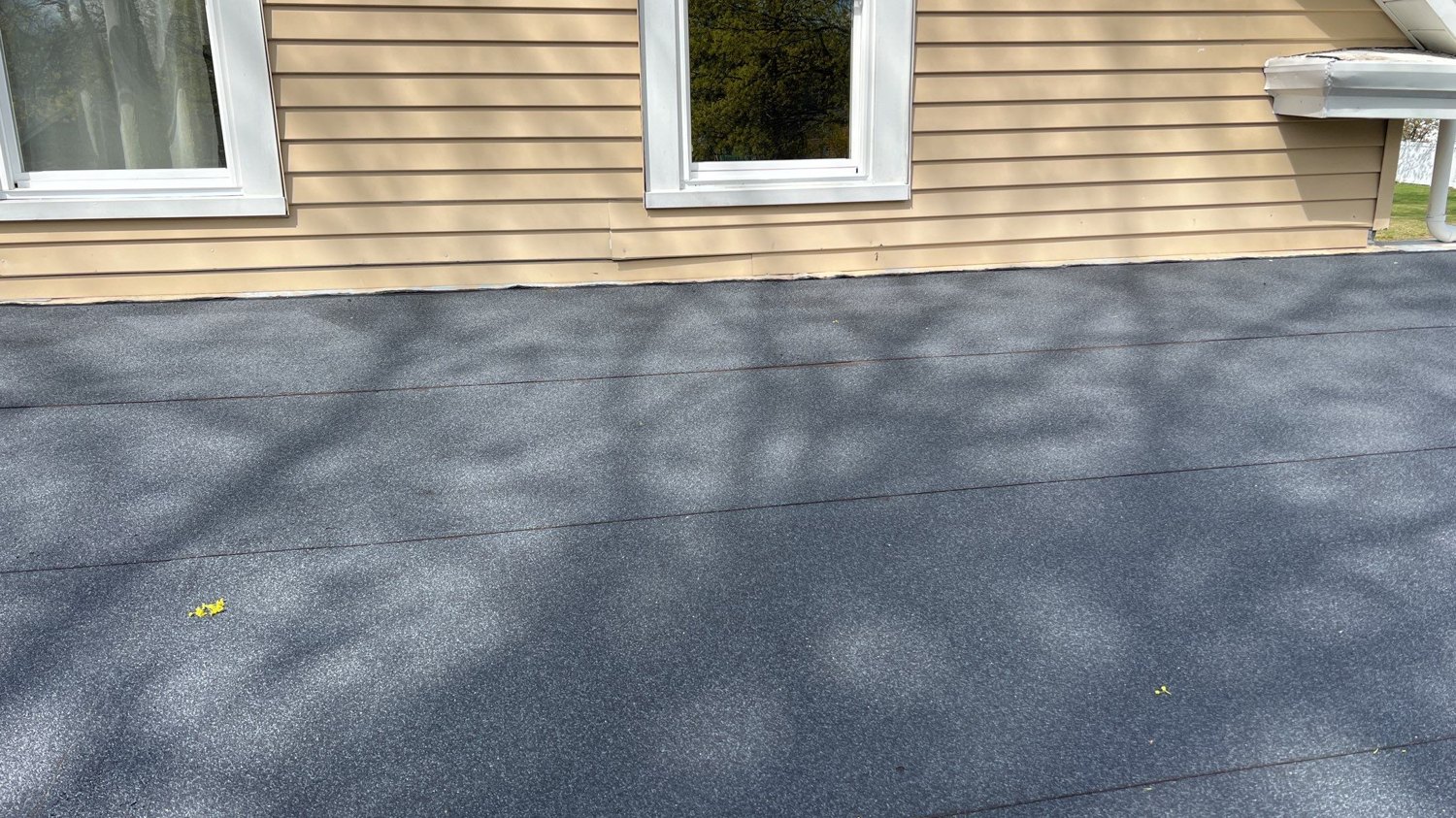 Curb-mounted VELUX skylight on a new modified-bitumen flat roof in Barrington, RI