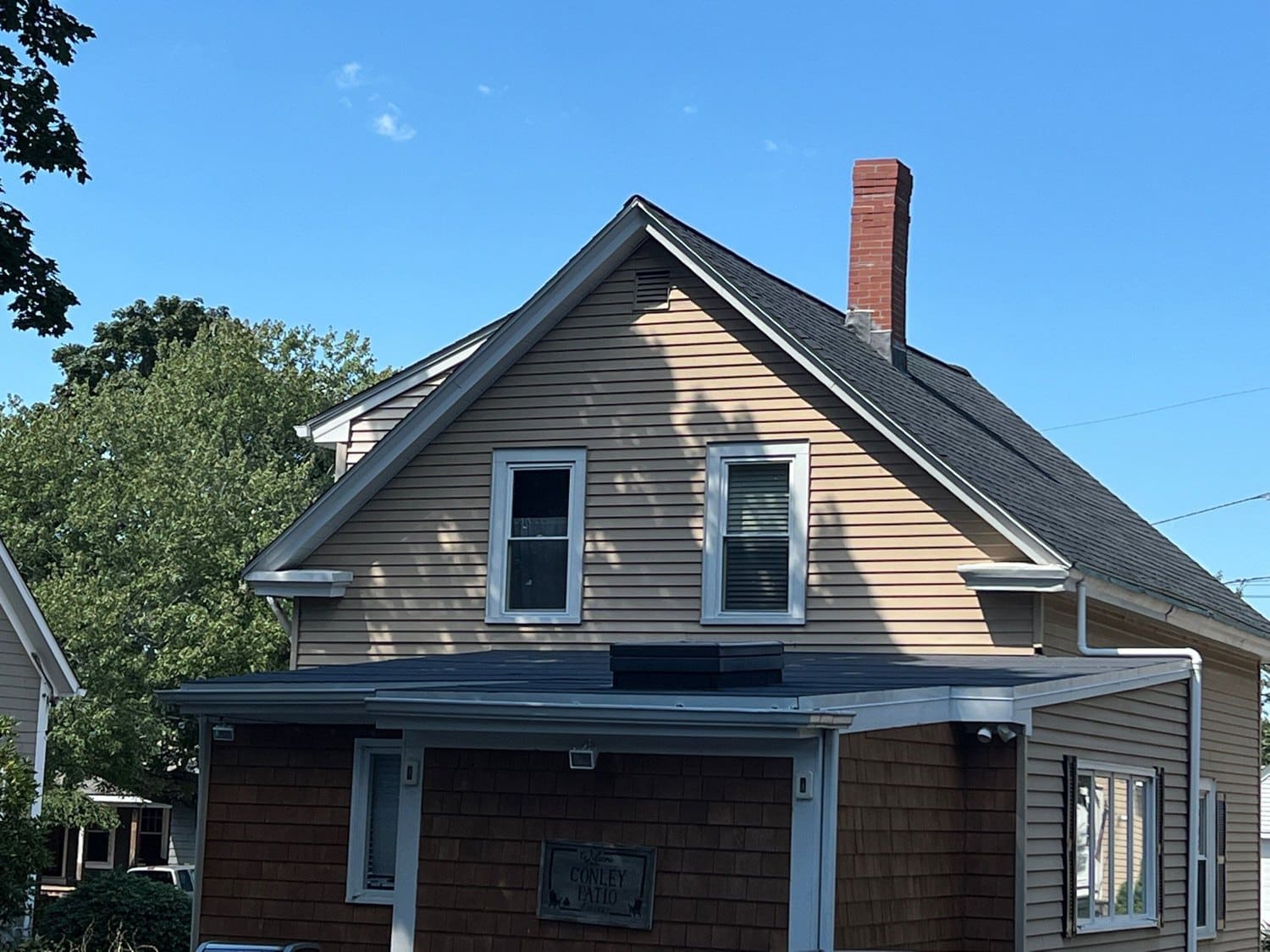 Finished cedar-shingle Barrington home after low-slope roof and skylight replacement