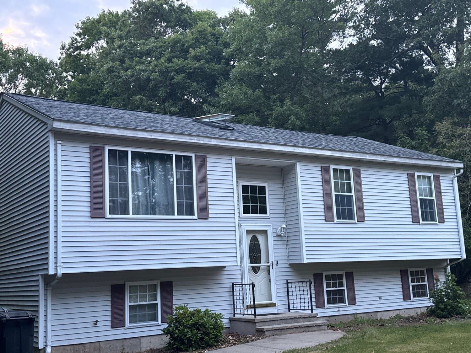 After — Seamless Gutters and Leaf Guards on a Coventry Landmark PRO Colonial Slate Roof