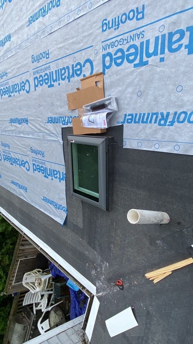 A VELUX skylight being flashed into the new Narragansett roof