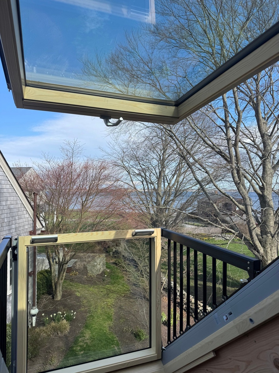 Showcase Project - VELUX Cabrio Balcony Jamestown RI - Completed VELUX Cabrio Balcony Skylight in the open balcony position with Narragansett Bay beyond