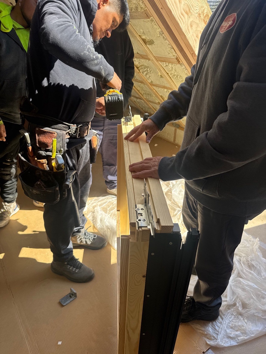 Showcase Project - VELUX Cabrio Balcony Jamestown RI - Shingle courses woven around the completed flashing — watertight integration with the roof plane
