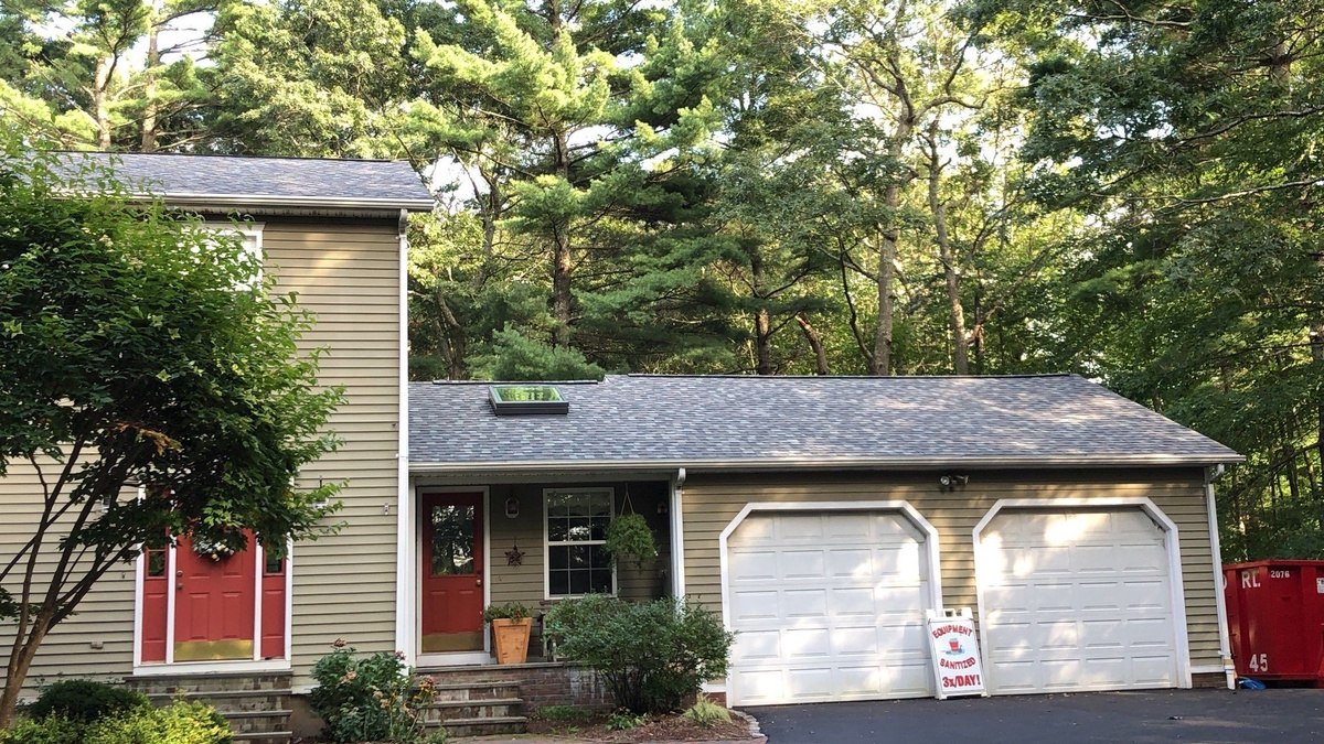 After — Seamless Gutters and Leaf Guards for a Wooded West Greenwich Home