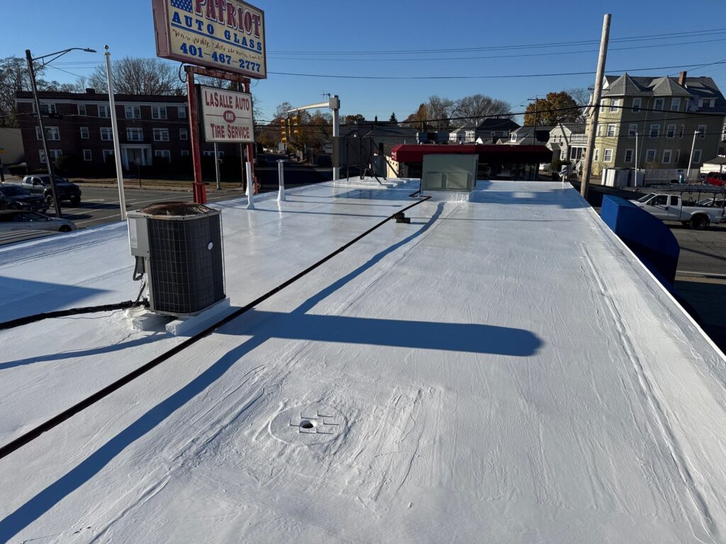 Commercial roofing in Cranston, RI with silicone coating — Project #11762 by Pinnacle Roofing & Skylights