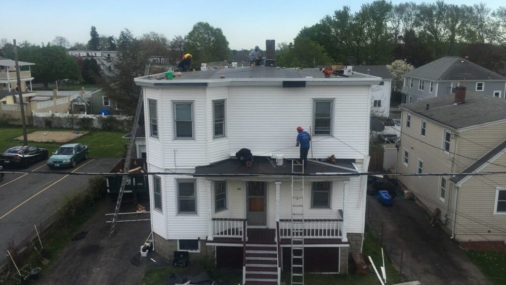 Commercial roofing in Cranston, RI with EPDM rubber membrane — Project #11815 by Pinnacle Roofing & Skylights