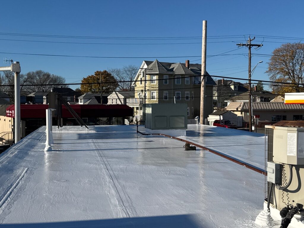 Commercial roofing in Cranston, RI with silicone coating — Project #11866 by Pinnacle Roofing & Skylights