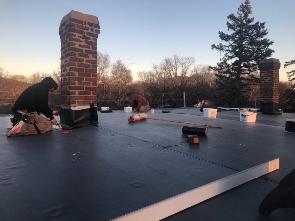 Commercial roofing in Cumberland, RI with EPDM rubber membrane — Project #11816 by Pinnacle Roofing & Skylights