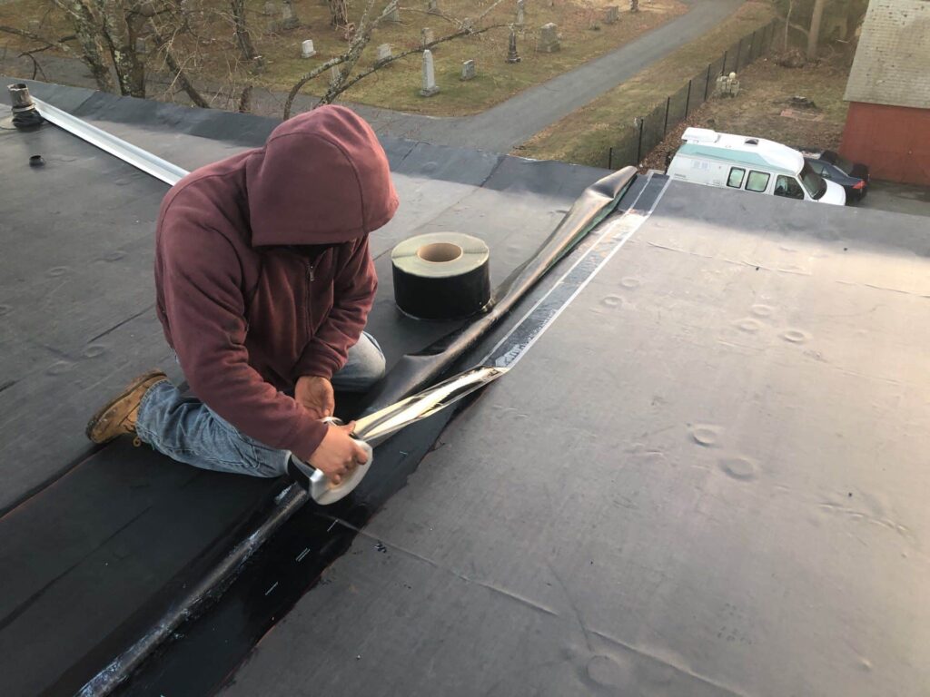 Commercial roofing in Cumberland, RI with EPDM rubber membrane — Project #11867 by Pinnacle Roofing & Skylights