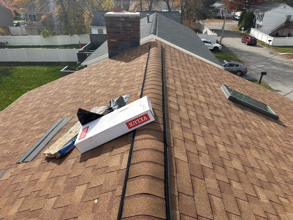 Roof replacement in Cumberland Hill, RI with VELUX skylights — Project #11954 by Pinnacle Roofing & Skylights