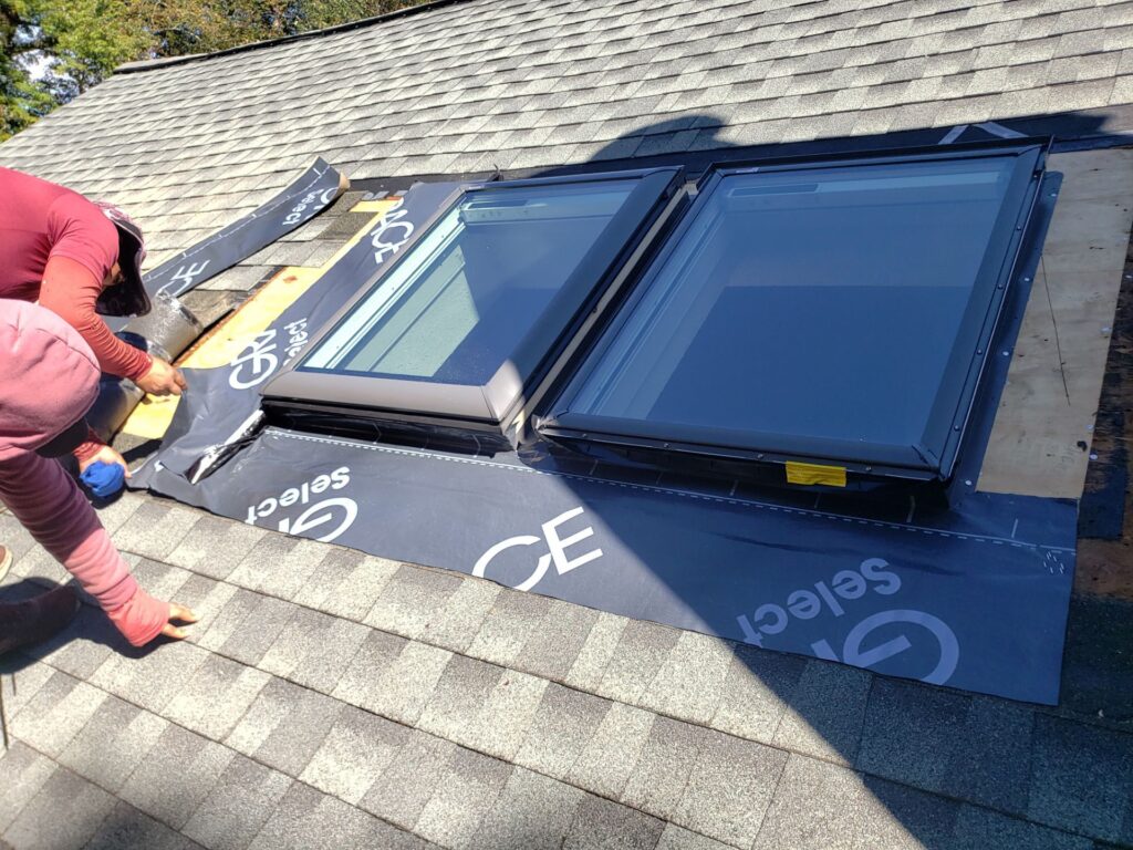 Skylight installation in East Greenwich, RI with VELUX skylights — Project #12360 by Pinnacle Roofing & Skylights