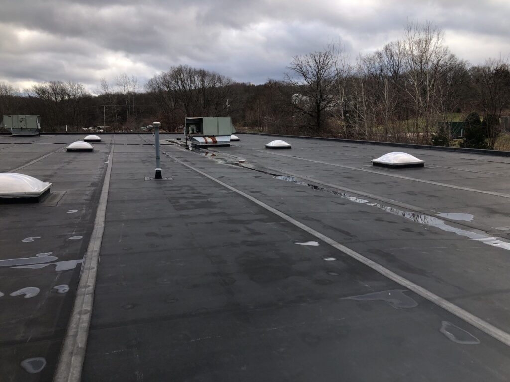 Commercial roofing in Lincoln, RI with EPDM rubber membrane — Project #11777 by Pinnacle Roofing & Skylights