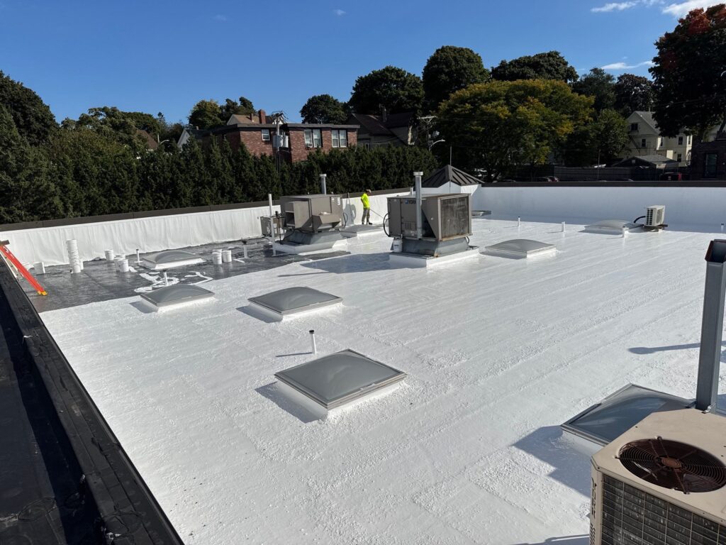 Commercial roofing in Pawtucket, RI with silicone coating — Project #11788 by Pinnacle Roofing & Skylights