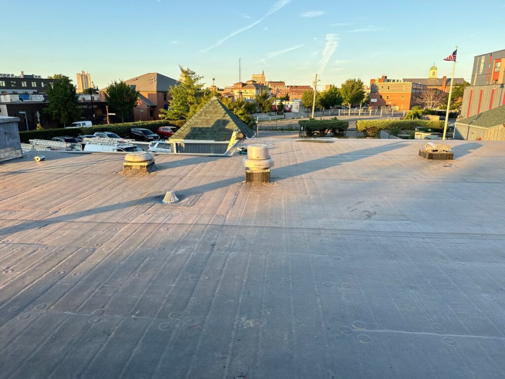 Commercial roofing in Providence, RI with EPDM rubber membrane — Project #12044 by Pinnacle Roofing & Skylights