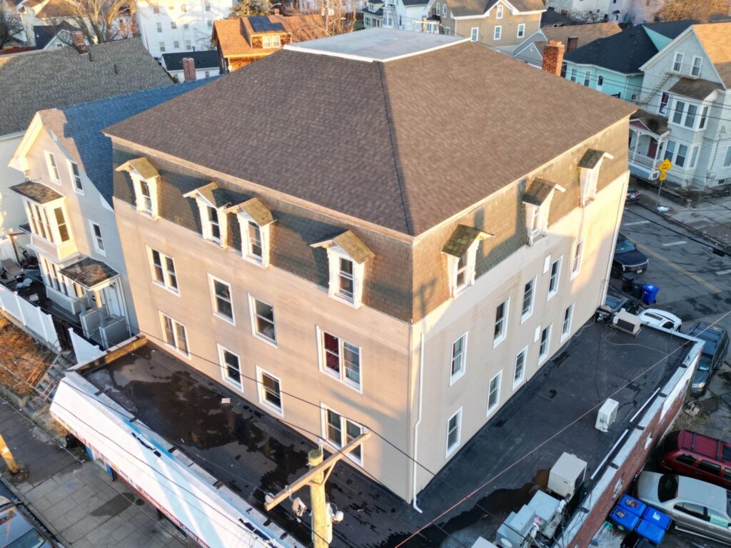 Commercial roofing in Providence, RI with EPDM rubber membrane — Project #12213 by Pinnacle Roofing & Skylights
