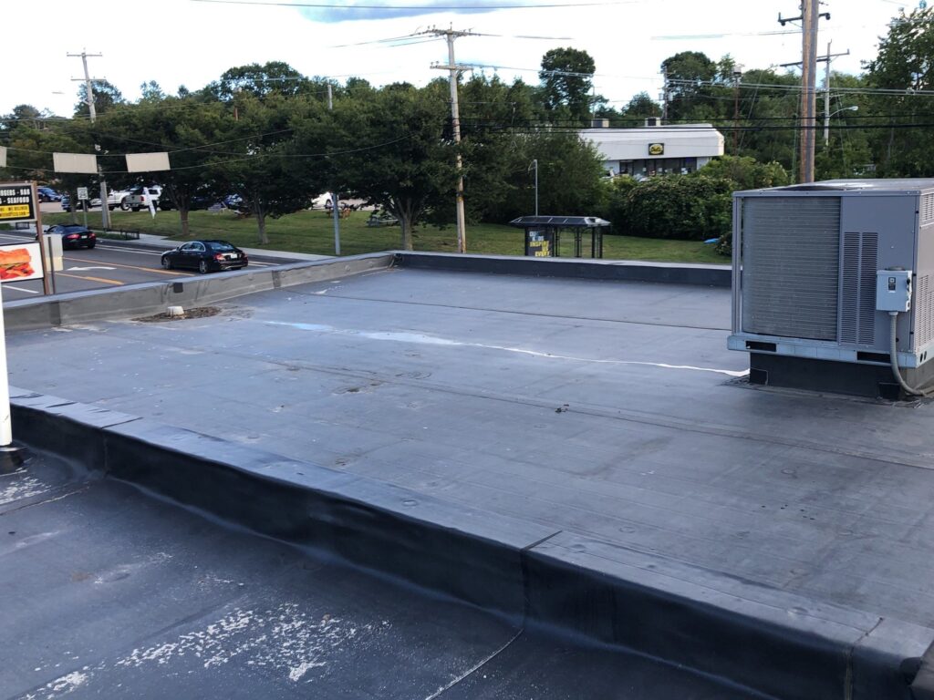 Commercial roofing in Wakefield, RI with EPDM rubber membrane — Project #11746 by Pinnacle Roofing & Skylights