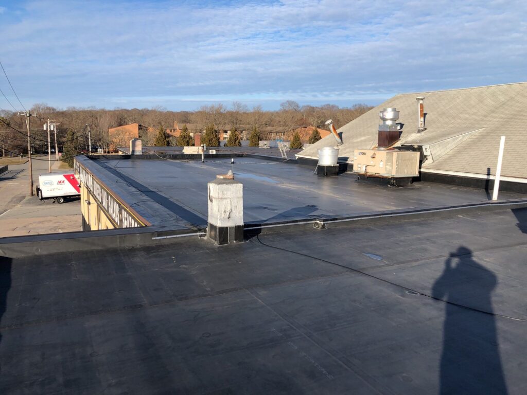 Commercial roofing in Wakefield, RI with EPDM rubber membrane — Project #11852 by Pinnacle Roofing & Skylights