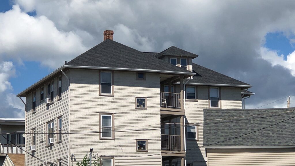 Commercial roofing in Woonsocket, RI with asphalt shingles — Project #11694 by Pinnacle Roofing & Skylights