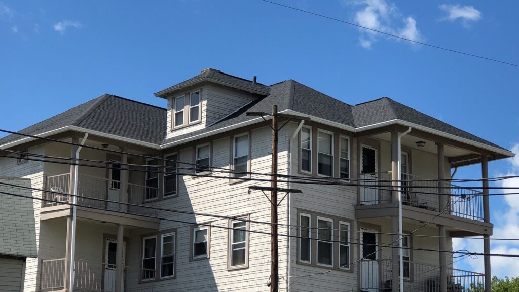 Commercial roofing in Woonsocket, RI with asphalt shingles — Project #11753 by Pinnacle Roofing & Skylights