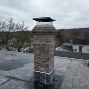 Repointed chimney with new cap North Providence RI flat roof