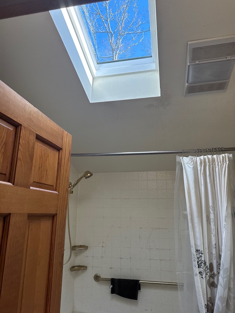 VELUX fixed skylight installed above bathroom in Kingston RI home